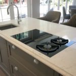 9. 9. The Bora Classic 2.0 is a minimalistic modular system. This setup consists of a two zone induction (which can be bridged) and two zone gas. The middle area is the extractor, which ducts outside the property.