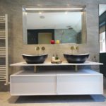 13. The two drawers provide good storage space. To the right is a tall recessed mirror storage cabinet.