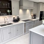 The handmade cabinetry on the island is finished in Farrow & Ball Worsted and the perimeter cabinetry in Farrow & Ball Cornforth white.