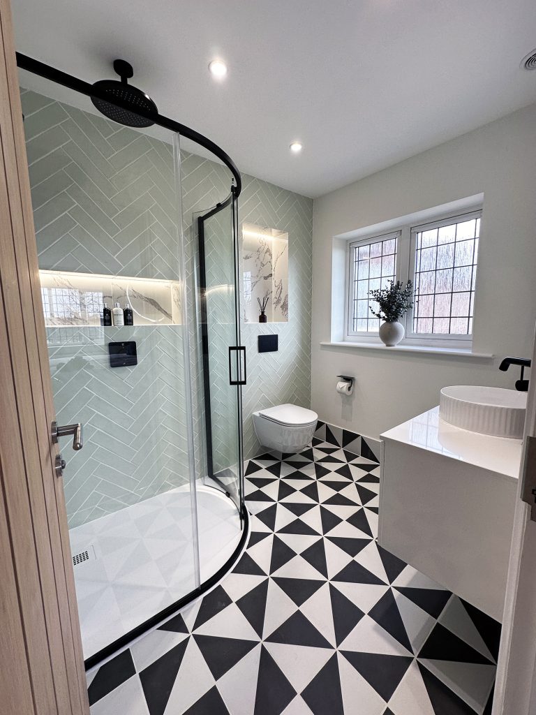 Matt black bathroom with Sage herringbone tiles (10)