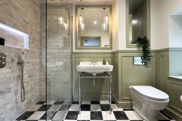 Traditional elegant shower room. Featuring tiles by Ca' Pietra and painted in Farrow & Ball 'French Gray'.