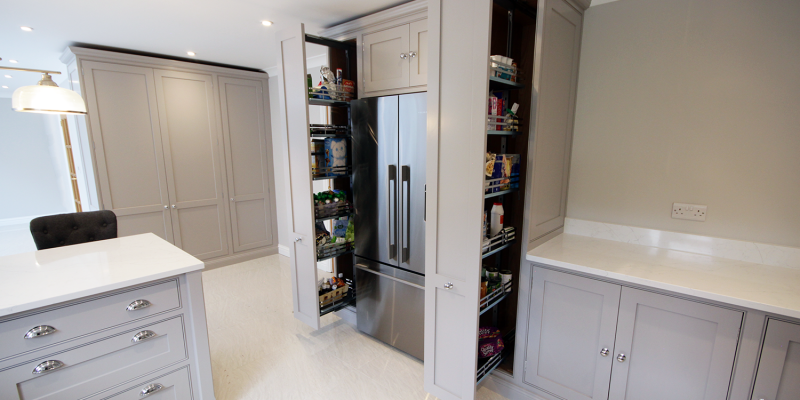 A huge amount of storage is gained through the use of pull out larder storage – a modern solution in a classic styled kitchen.