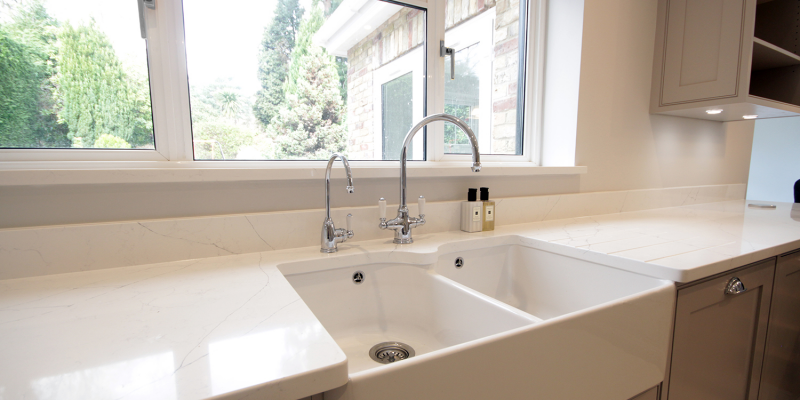 We are proud Perrin & Rowe dealers and here we have a belfast sink with tap, and also a separate boiling water tap all made in the UK.